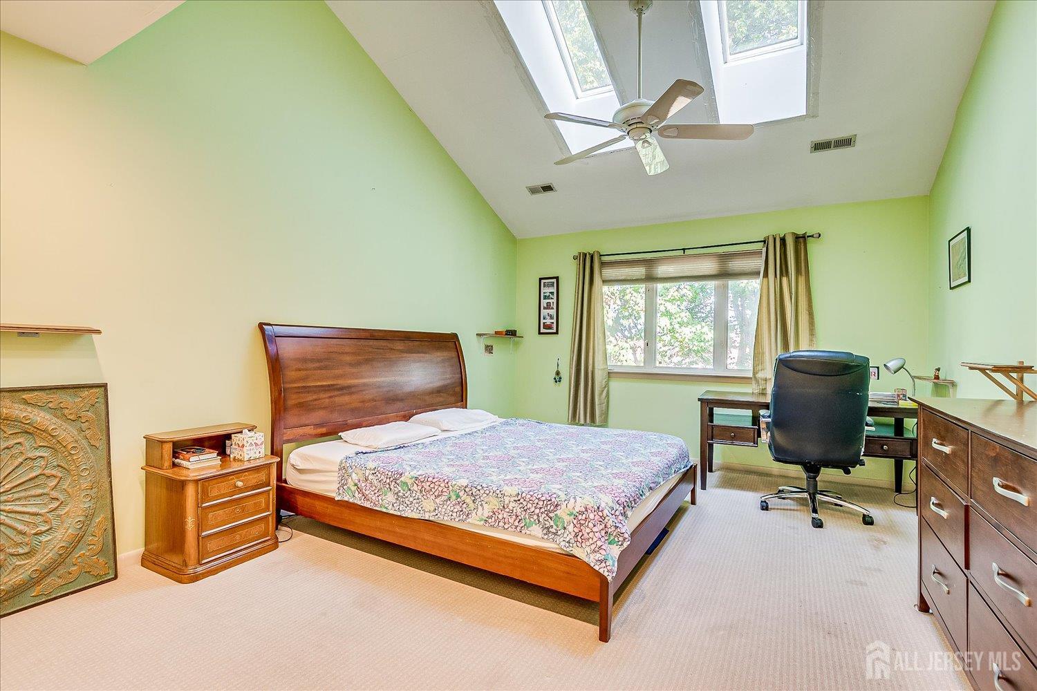 118 Coppertree Court Edison, NJ 08820 - Photo 31 of 58 a bedroom with a bed a table and chair