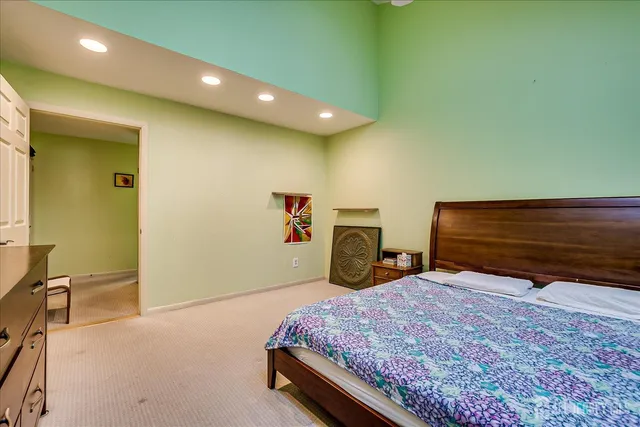 a bedroom with a bed and chair