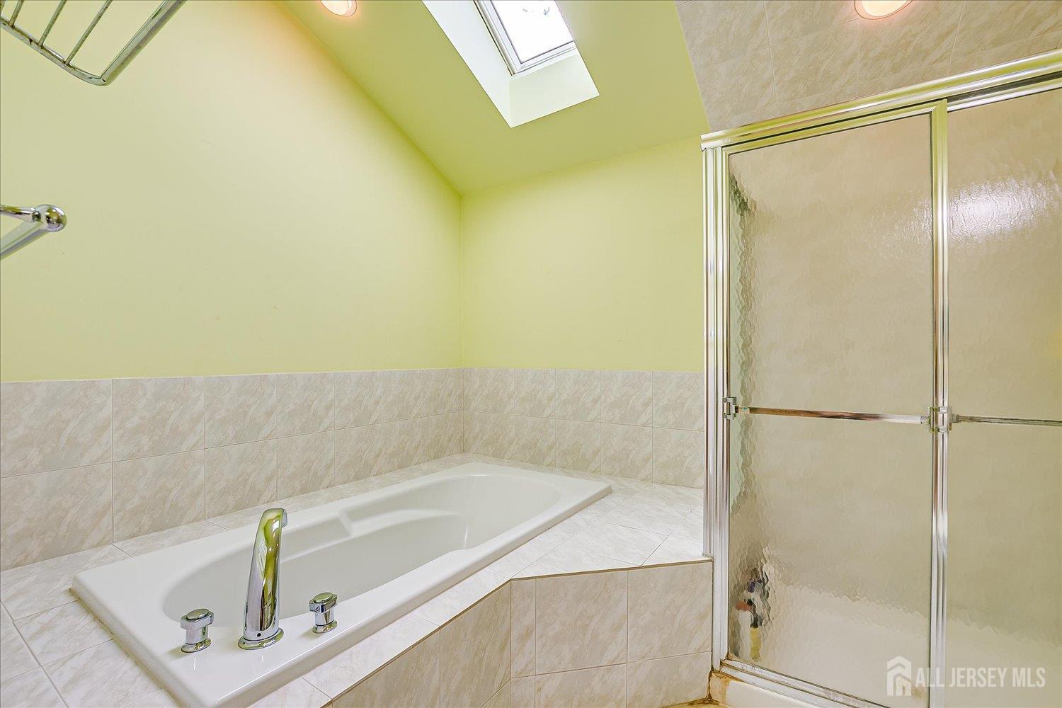 118 Coppertree Court Edison, NJ 08820 - Photo 34 of 58 a bathroom with a tub and a shower