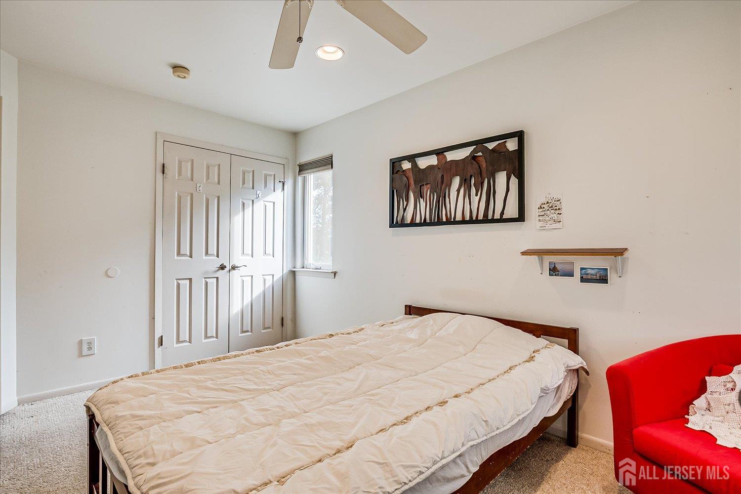 118 Coppertree Court Edison, NJ 08820 - Photo 36 of 58 a bedroom with a bed and chair