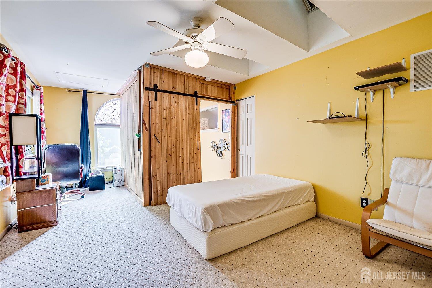 118 Coppertree Court Edison, NJ 08820 - Photo 39 of 58 a bedroom with a bed couch and a window