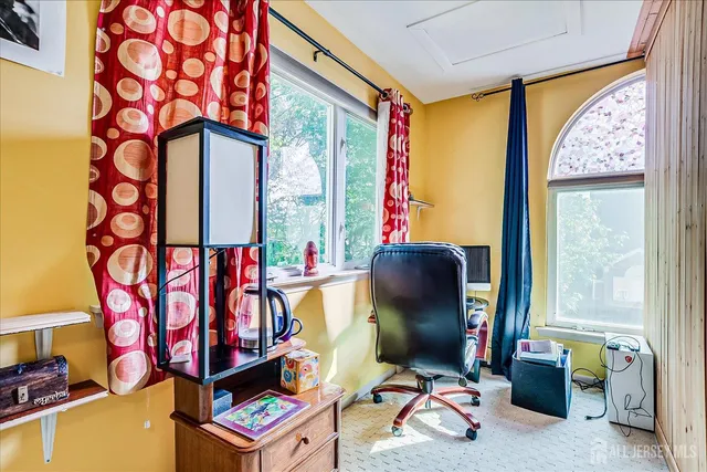 a front view of a house with yard porch and sitting area