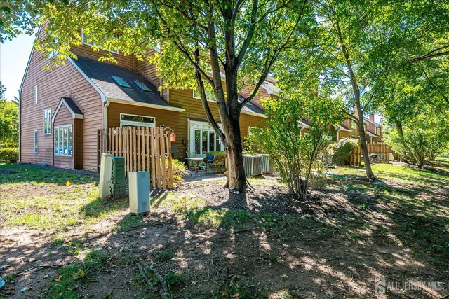 a view of a backyard with swimming pool