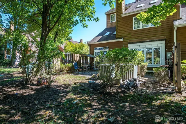 a view of sign board with plants