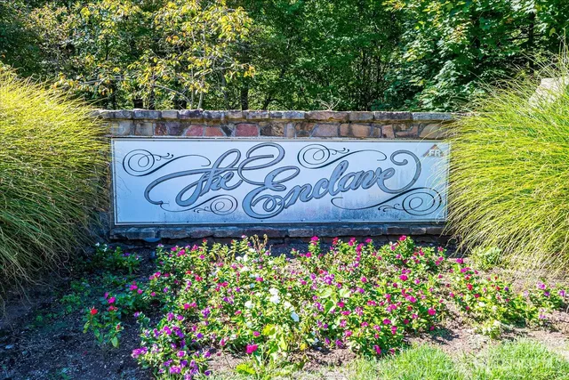 a view of a house with a yard and garden