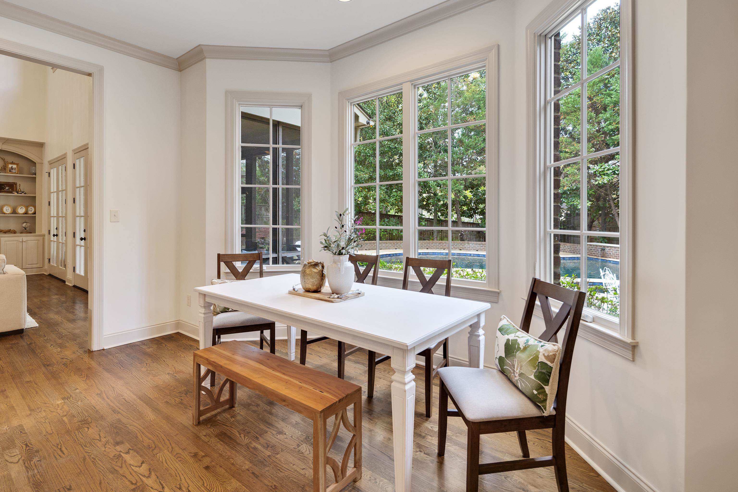 101 North Grove Park Road Memphis, TN 38117 - Photo 14 of 40 Dining area featuring crown molding, wood finished floors, and healthy amount of natural light