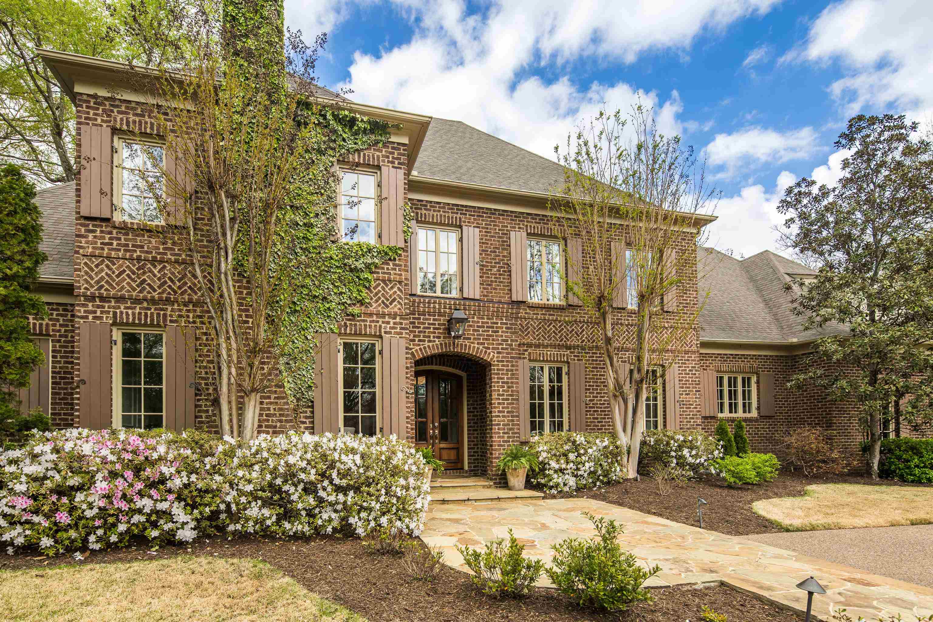 101 North Grove Park Road Memphis, TN 38117 - Photo 2 of 40 View of front of property with brick siding and roof with shingles