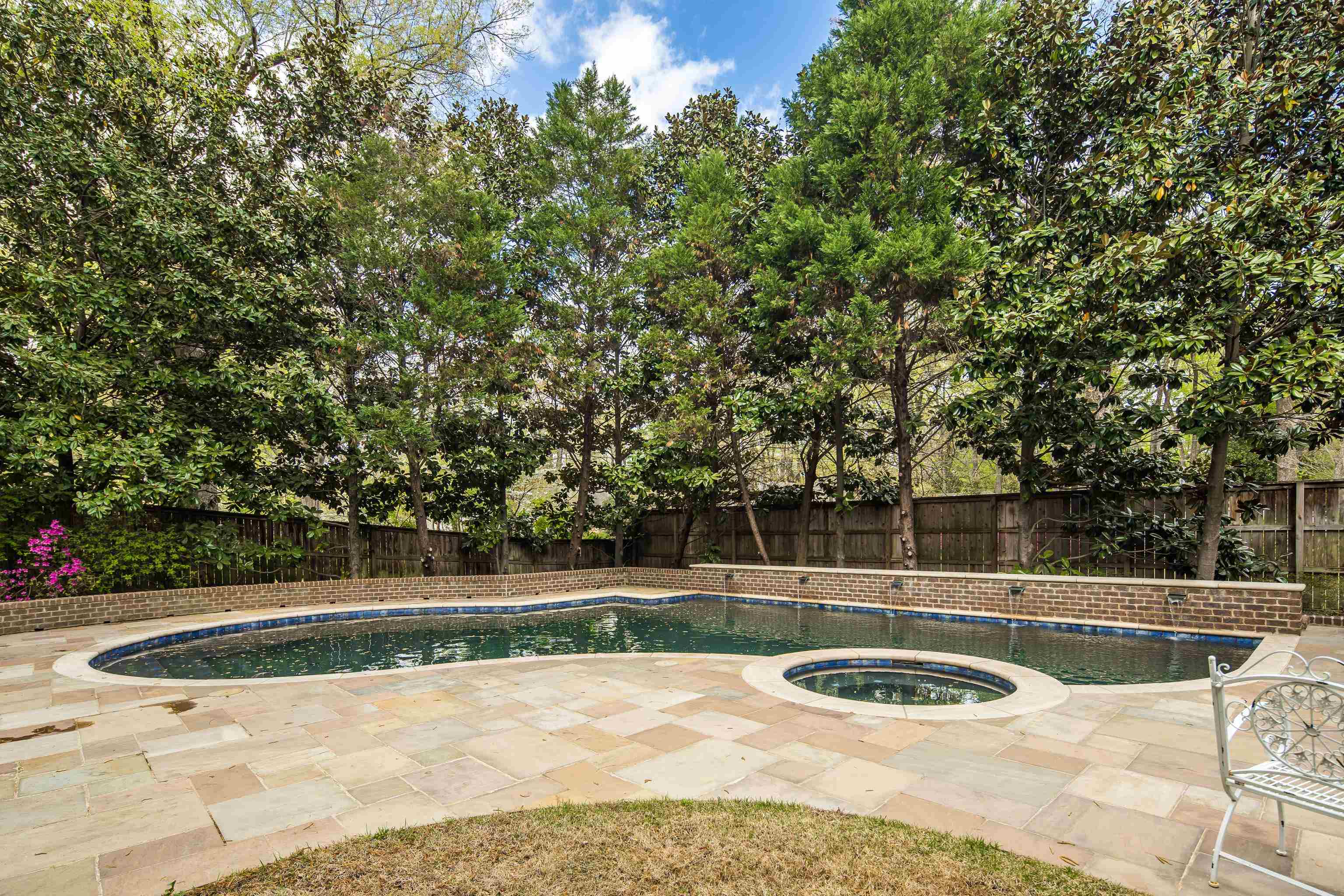 101 North Grove Park Road Memphis, TN 38117 - Photo 29 of 40 Relaxing pool / spa featuring a patio and a fenced backyard