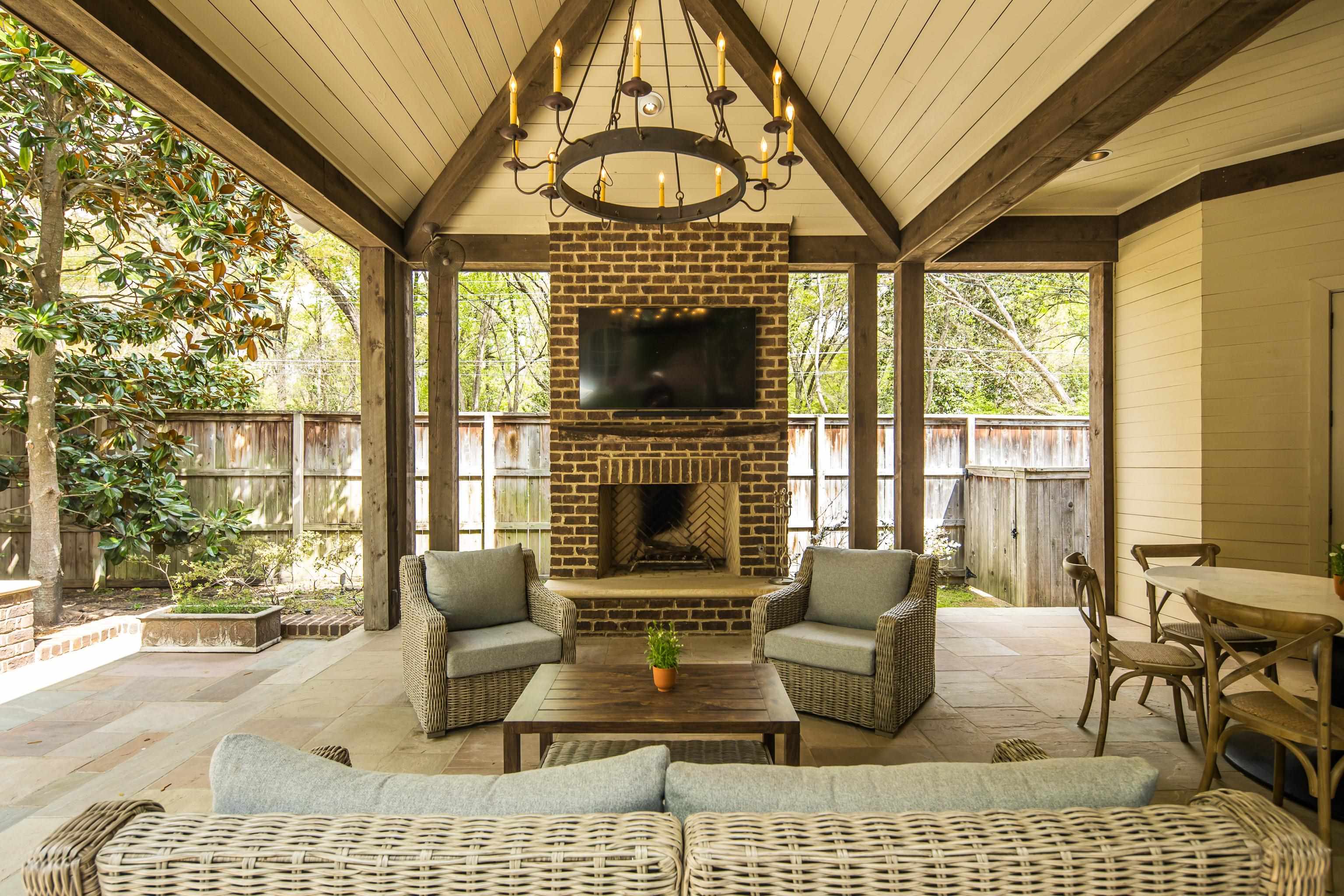 101 North Grove Park Road Memphis, TN 38117 - Photo 31 of 40 Fenced backyard with a patio area and an outdoor living space with a fireplace