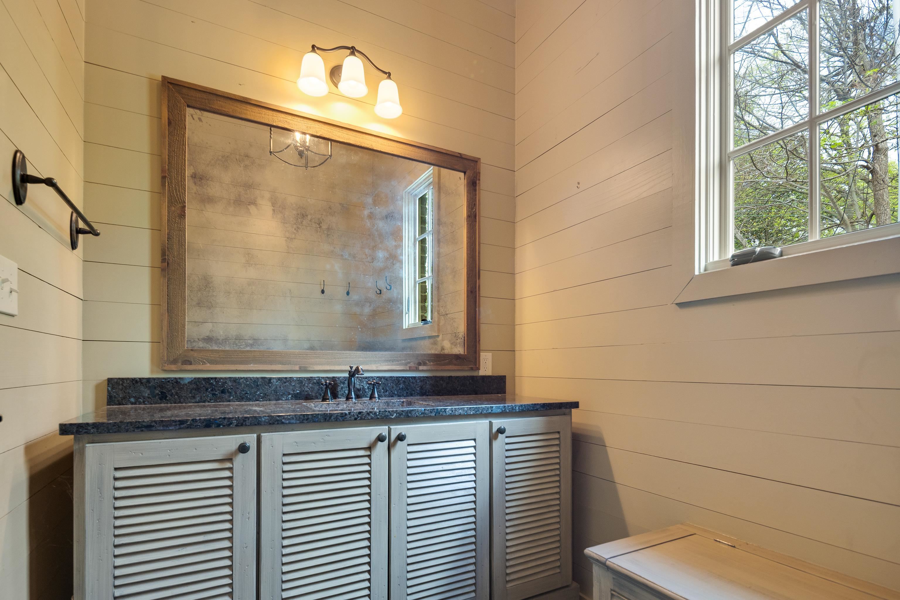 101 North Grove Park Road Memphis, TN 38117 - Photo 32 of 40 Bathroom with wooden walls and vanity