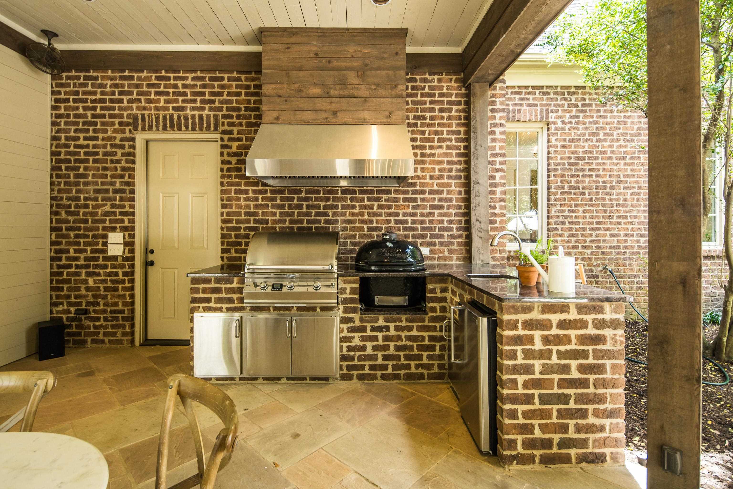 101 North Grove Park Road Memphis, TN 38117 - Photo 34 of 40 View of patio with exterior kitchen and a sink