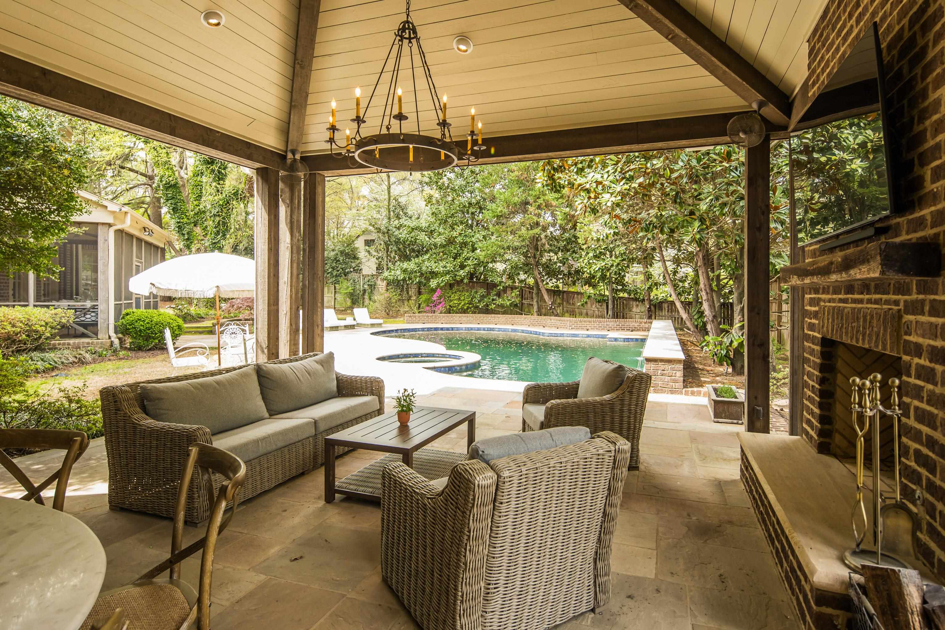 101 North Grove Park Road Memphis, TN 38117 - Photo 35 of 40 Fenced backyard featuring a patio area, an outdoor pool, and an outdoor living space with a fireplace