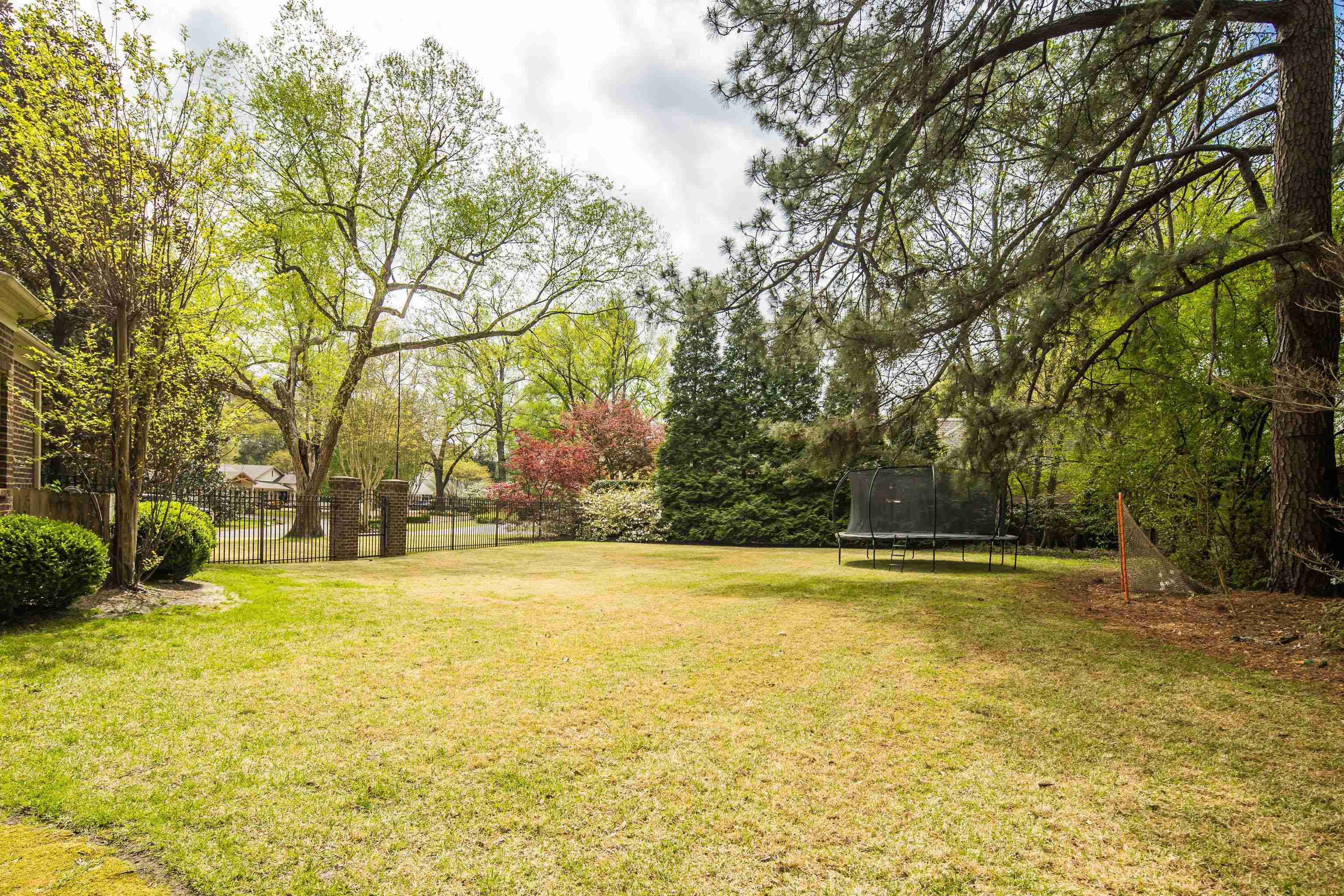 101 North Grove Park Road Memphis, TN 38117 - Photo 37 of 40 Fenced backyard featuring a trampoline