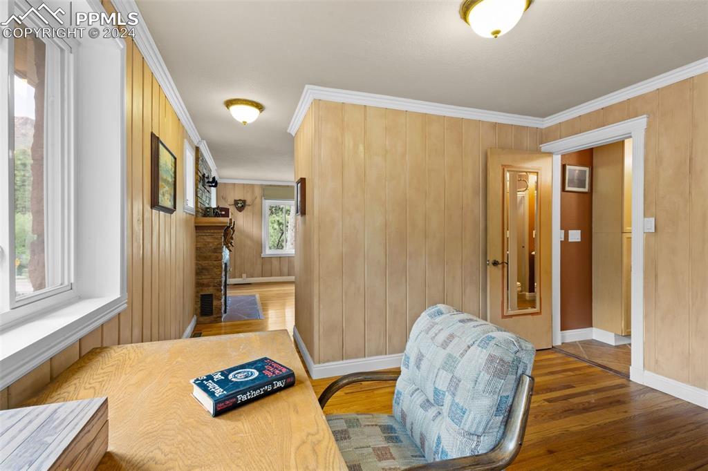 7955 Highway 24 Cascade, CO 80809 - Photo 11 of 44 a bedroom with a bed and wooden floor