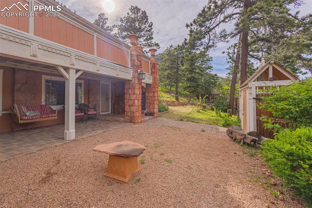 7955 Highway 24 Cascade, CO 80809 - Photo 27 of 44 a view of a house with backyard and trees