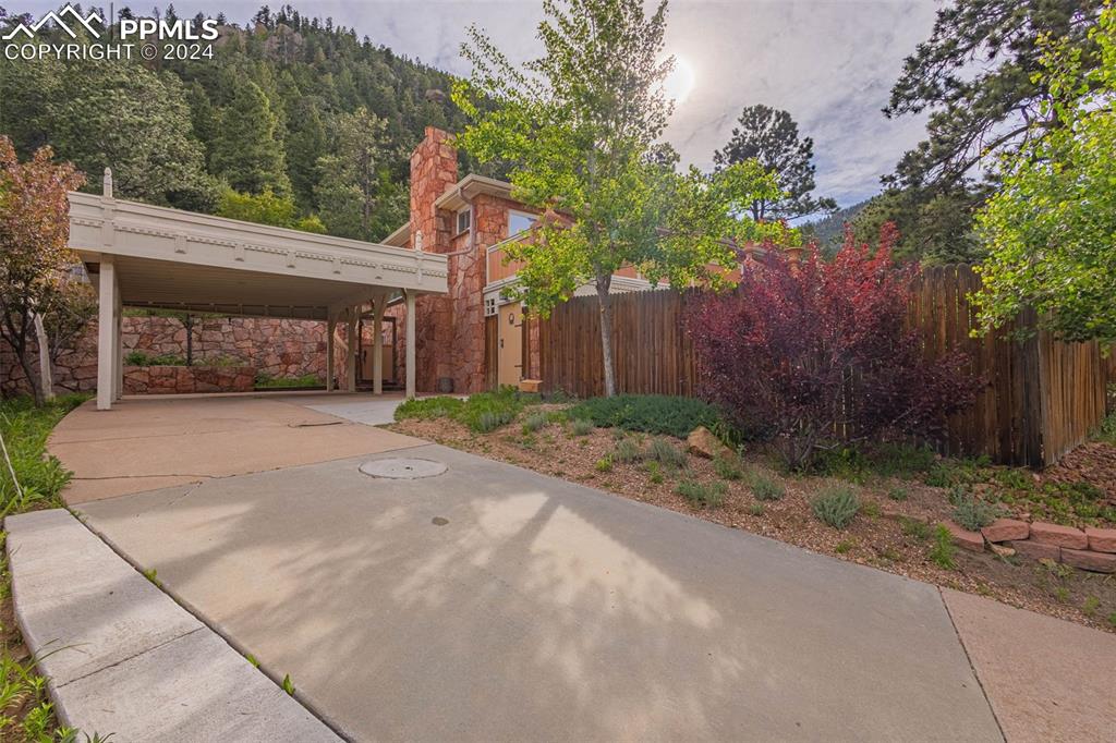 7955 Highway 24 Cascade, CO 80809 - Photo 31 of 44 a front view of a house with garden