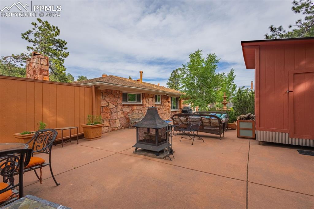 7955 Highway 24 Cascade, CO 80809 - Photo 33 of 44 a view of a patio with a table and chairs