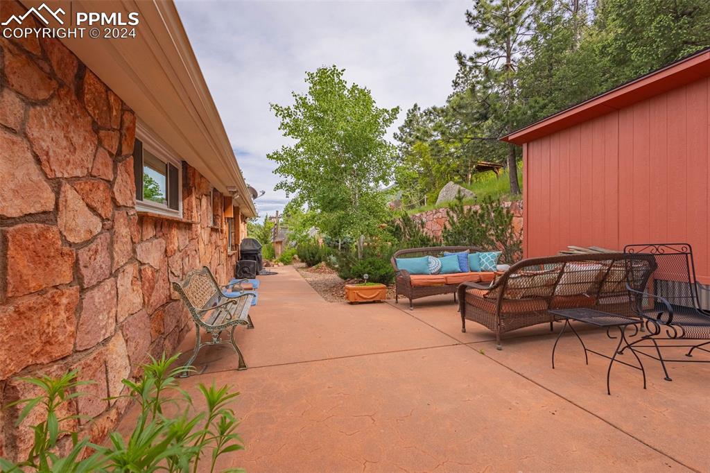 7955 Highway 24 Cascade, CO 80809 - Photo 34 of 44 a view of a patio with table and chairs and potted plants