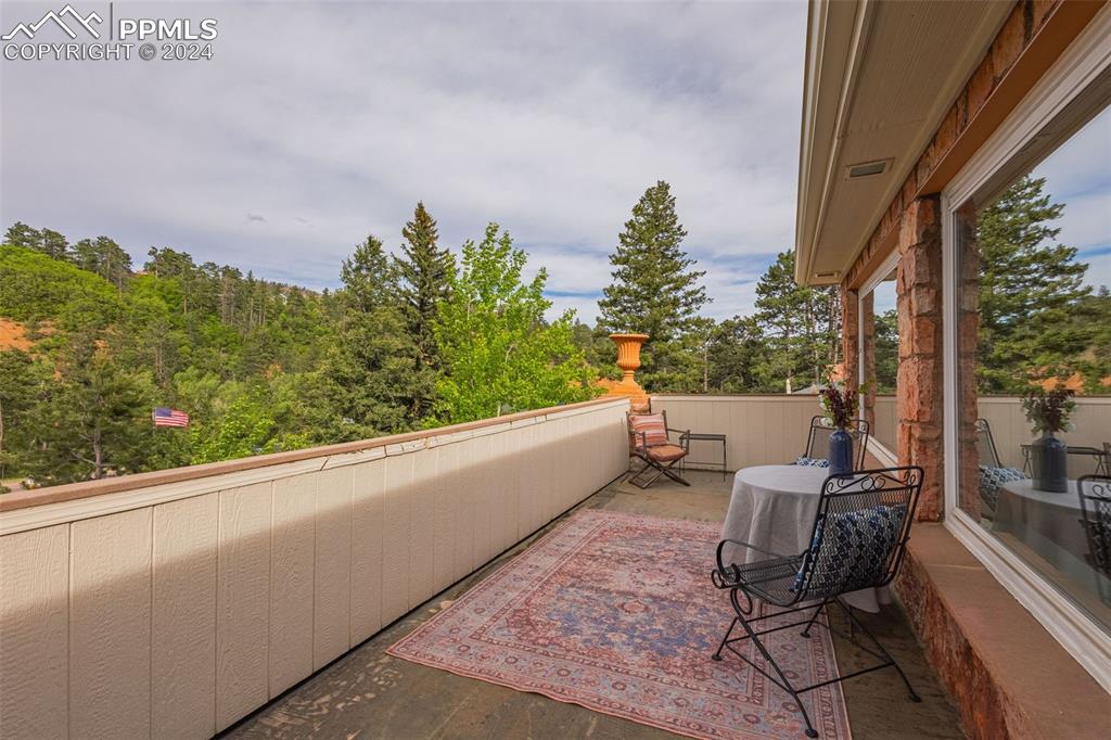 7955 Highway 24 Cascade, CO 80809 - Photo 38 of 44 a view of a chairs and table in a balcony