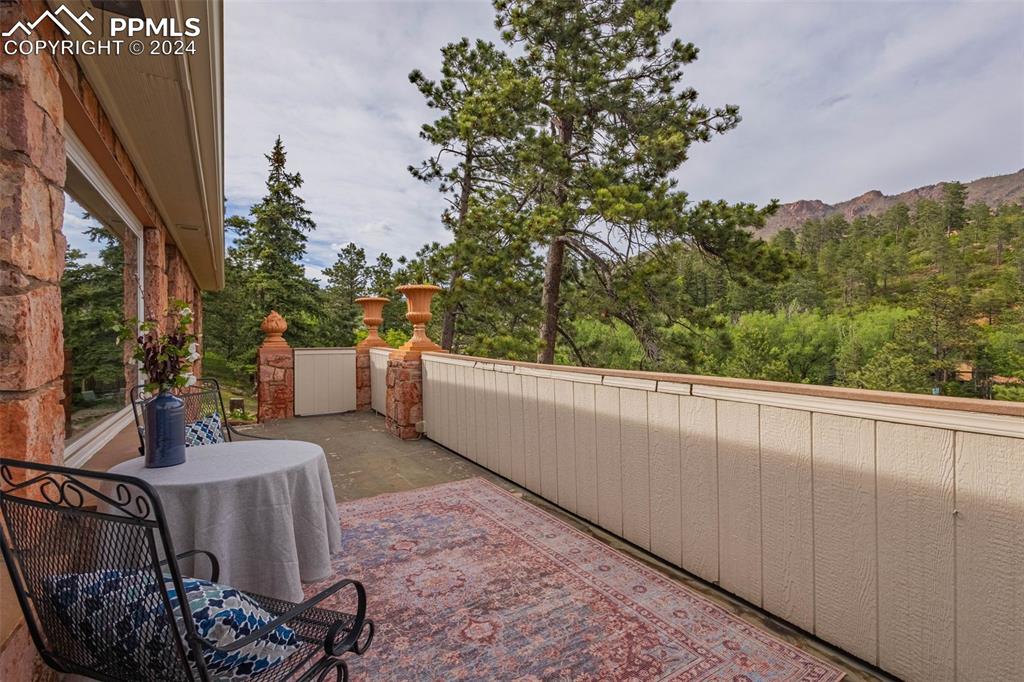7955 Highway 24 Cascade, CO 80809 - Photo 39 of 44 a balcony with table and chairs