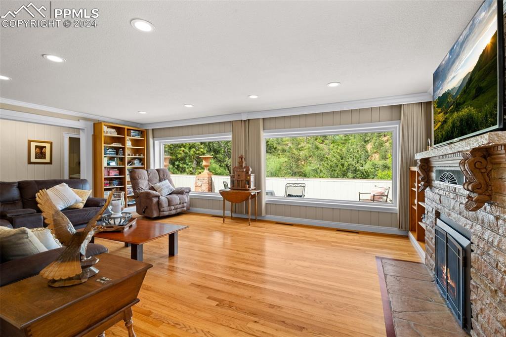 7955 Highway 24 Cascade, CO 80809 - Photo 4 of 44 a living room with fireplace furniture and a flat screen tv