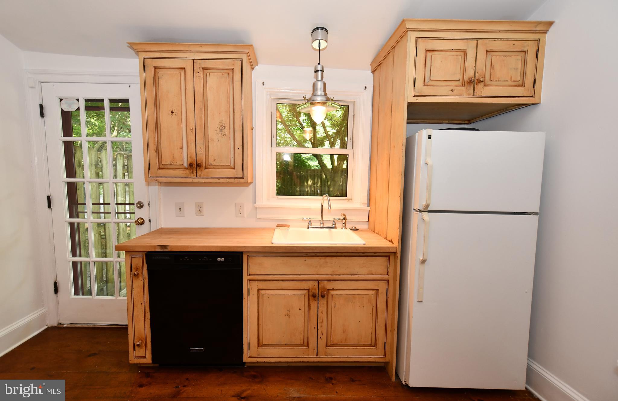 113 Brookhaven Road Wallingford, PA 19086 - Photo 12 of 43 Kitchen with exit to rear patio and fenced yard