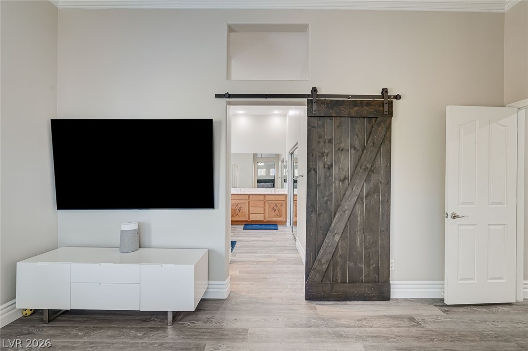 2391 Rainswept Avenue Henderson, NV 89052 - Photo 56 of 62 This interior hallway features a modern aesthetic with convenient access to the primary bathroom.