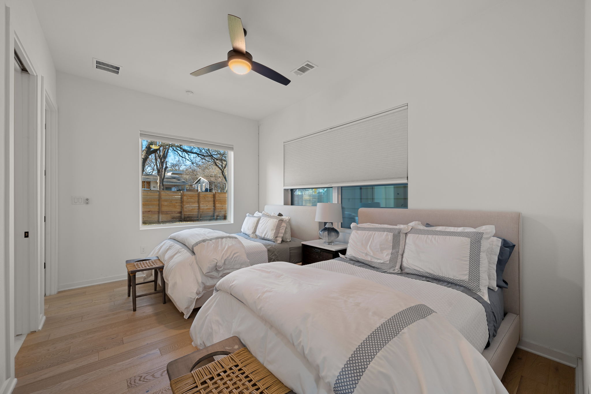 910 Nalide Street, Unit B Austin, TX 78745 - Photo 18 of 38 a bedroom with two beds and painting on the wall