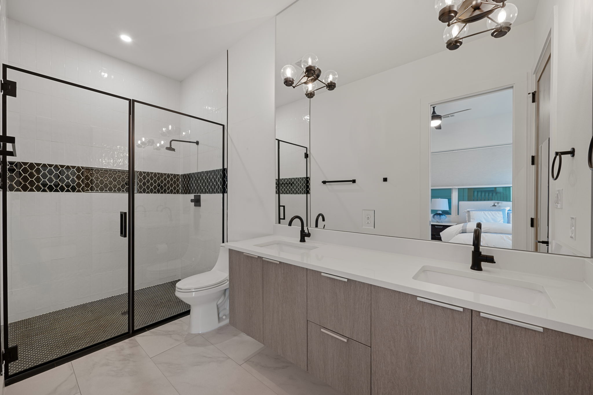 910 Nalide Street, Unit B Austin, TX 78745 - Photo 20 of 38 a bathroom with a sink and mirror with toilet