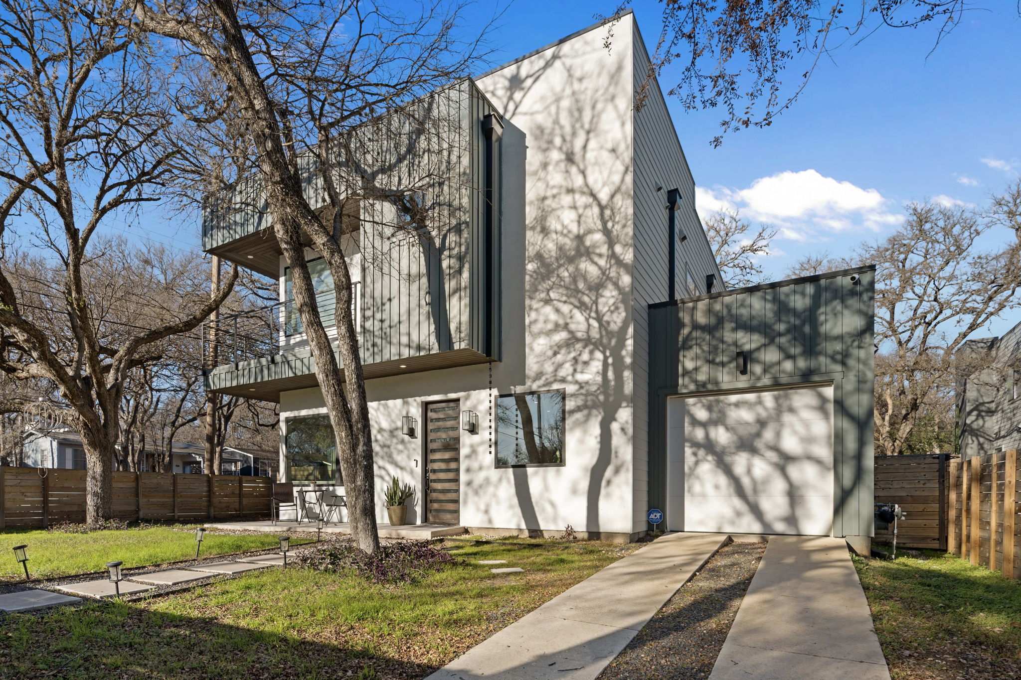 910 Nalide Street, Unit B Austin, TX 78745 - Photo 2 of 38 a view of a house with a yard