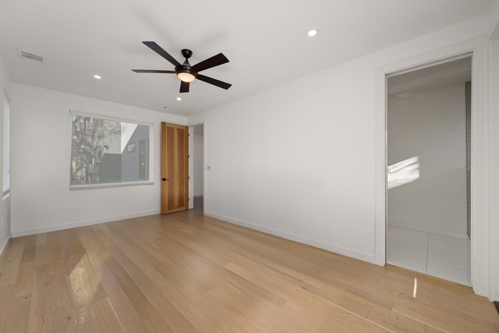 910 Nalide Street, Unit B Austin, TX 78745 - Photo 22 of 38 a view of an empty room with a window