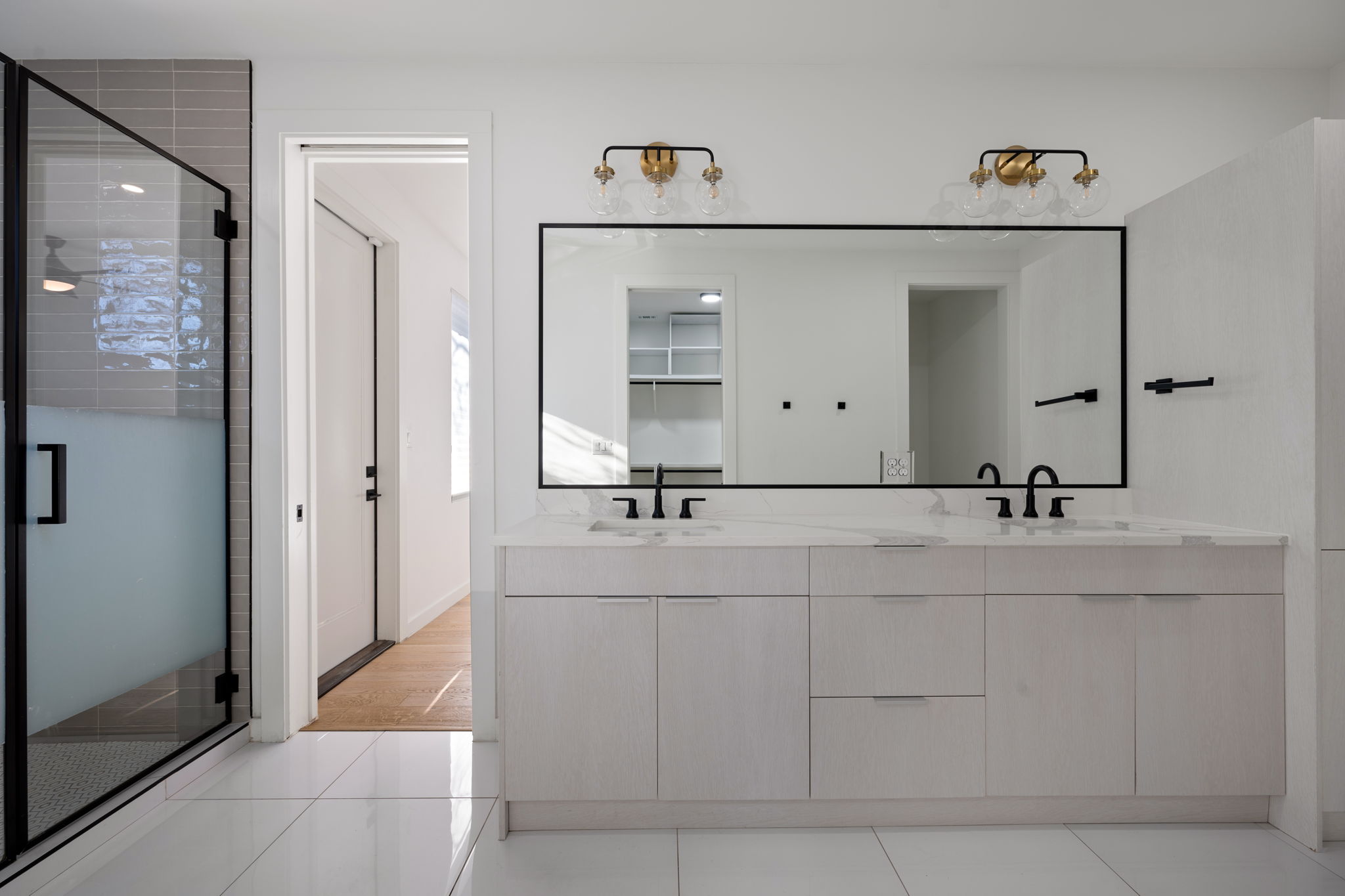 910 Nalide Street, Unit B Austin, TX 78745 - Photo 24 of 38 a bathroom with a sink and mirror