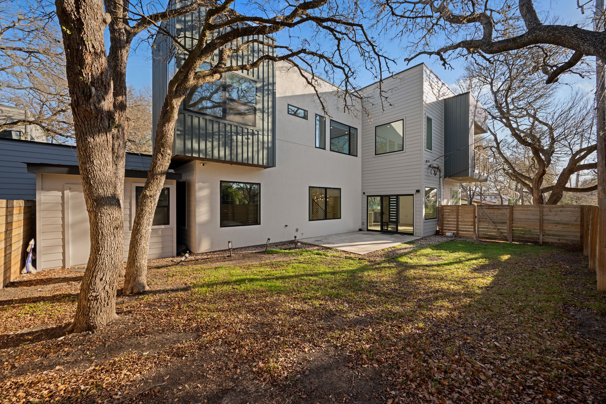 910 Nalide Street, Unit B Austin, TX 78745 - Photo 32 of 38 a view of a house with a yard covered with snow
