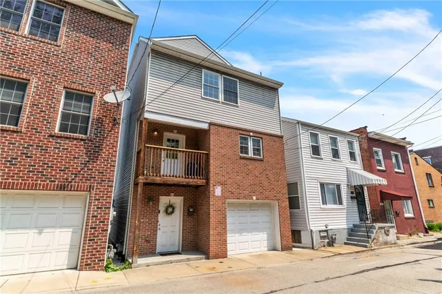 a front view of multiple houses