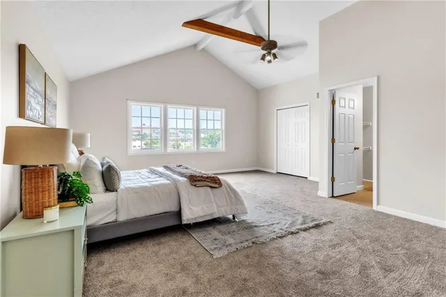 a bed room with a bed and a window