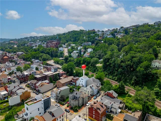 an aerial view of a city with lots of residential buildings