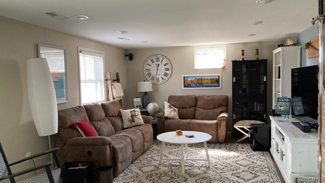 2886 West Lake Road Skaneateles, NY 13152 - Photo 14 of 28 Going downstairs to almost another home is the liv