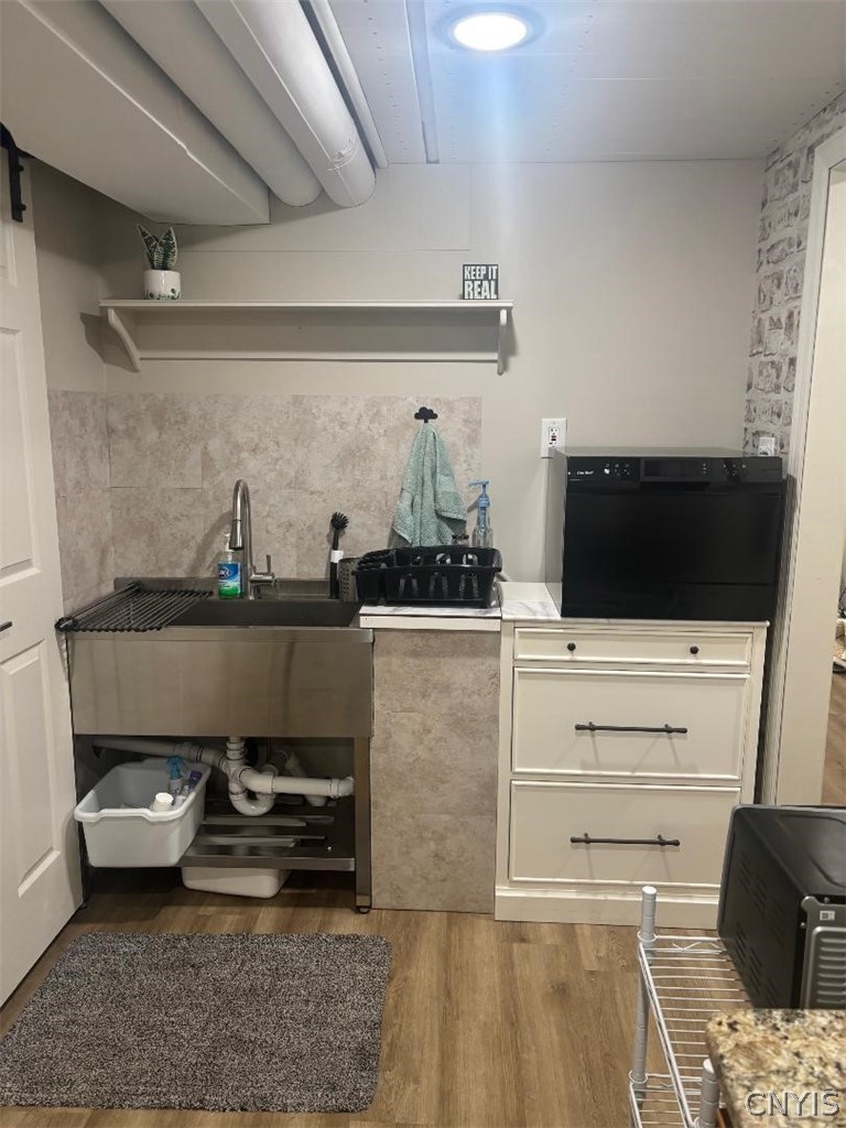 2886 West Lake Road Skaneateles, NY 13152 - Photo 20 of 28 Behind the barn doors ion the left s the laundry.