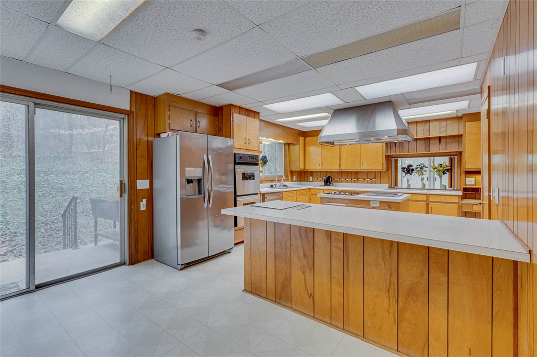200 Valley View Drive Clemson, SC 29631 - Photo 13 of 31 This spacious kitchen offers ample counter space, a large kitchen island, and convenient outdoor access.