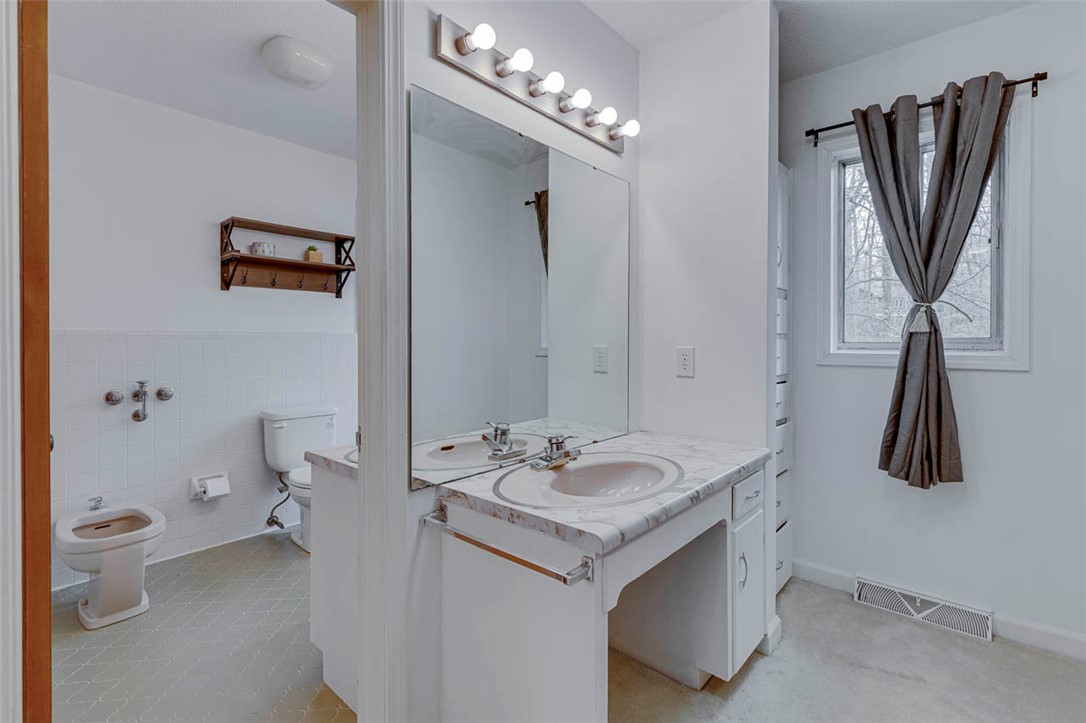 200 Valley View Drive Clemson, SC 29631 - Photo 17 of 31 This bathroom features a functional vanity, bidet, and a window for natural light.