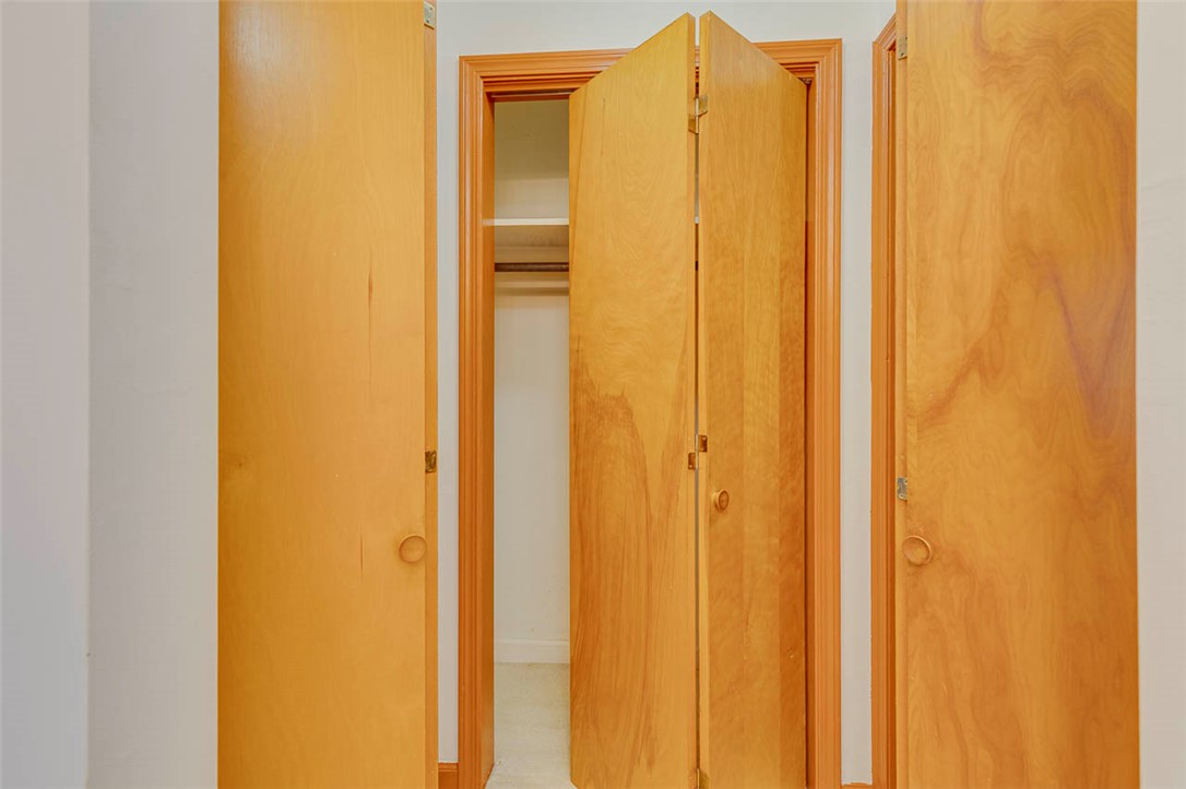 200 Valley View Drive Clemson, SC 29631 - Photo 18 of 31 This interior image showcases an open closet featuring a rod and shelving, offering practical storage.