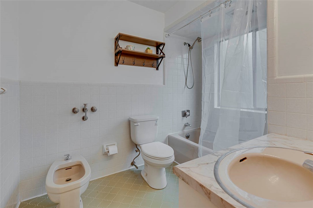 200 Valley View Drive Clemson, SC 29631 - Photo 19 of 31 This functional bathroom includes a combination tub and shower, a bidet, and a vanity with a single sink.