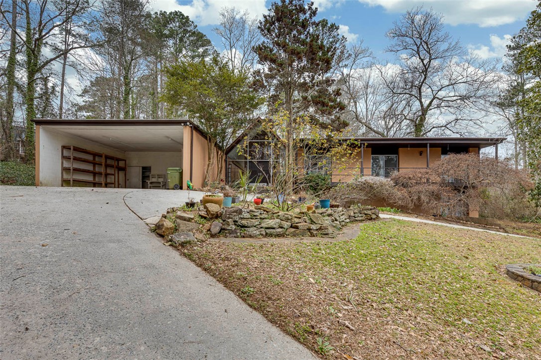 200 Valley View Drive Clemson, SC 29631 - Photo 2 of 31 This charming home features a covered carport and lush, mature trees.