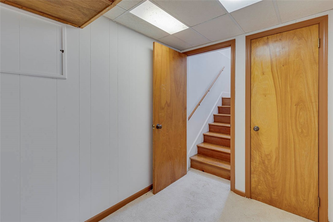 200 Valley View Drive Clemson, SC 29631 - Photo 22 of 31 This interior features a well-maintained staircase with light wooden steps, offering a cozy ambiance.