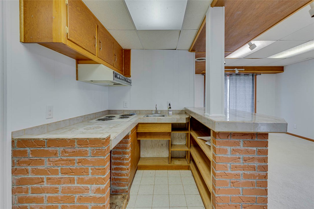 200 Valley View Drive Clemson, SC 29631 - Photo 26 of 31 This kitchen features a practical layout with classic brick and wood details, perfect for everyday living.