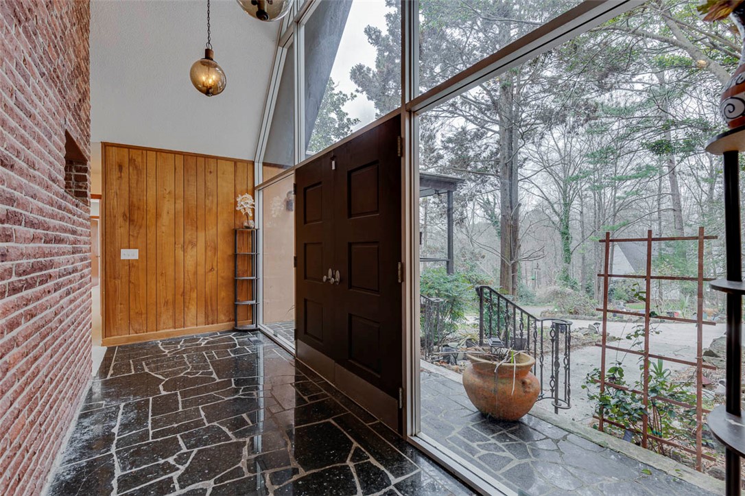 200 Valley View Drive Clemson, SC 29631 - Photo 3 of 31 This entry showcases a unique design with expansive windows and rustic accents.
