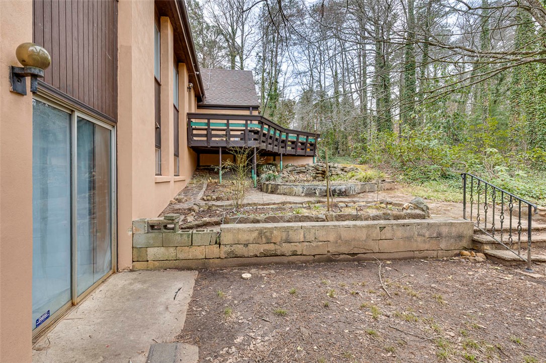 200 Valley View Drive Clemson, SC 29631 - Photo 31 of 31 This property features a charming patio and a large deck, perfect for enjoying the peaceful backyard.