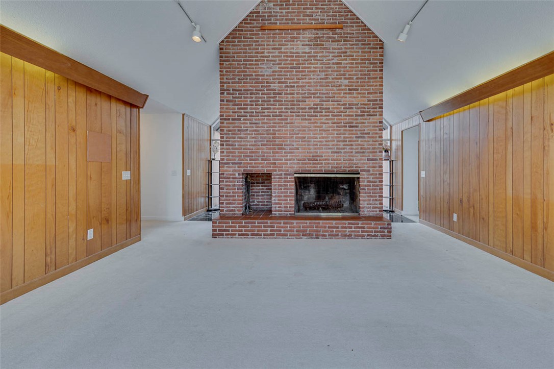 200 Valley View Drive Clemson, SC 29631 - Photo 5 of 31 This living area features a brick fireplace, creating a warm and inviting atmosphere.