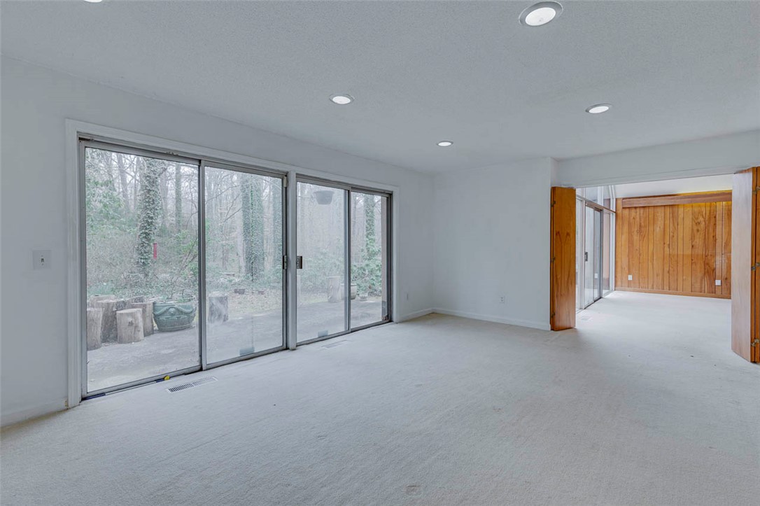 200 Valley View Drive Clemson, SC 29631 - Photo 7 of 31 This living room offers bright recessed lighting and sliding glass doors that lead to a private outdoor space.