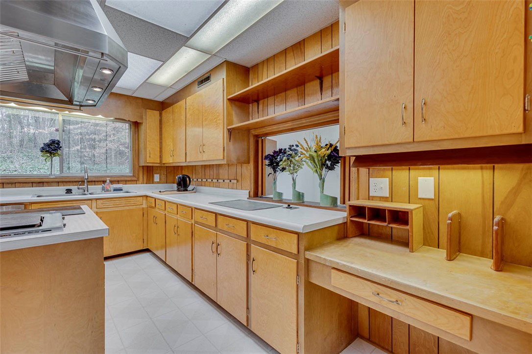 200 Valley View Drive Clemson, SC 29631 - Photo 8 of 31 This kitchen features a spacious layout with ample cabinetry and built-in cooking surfaces.